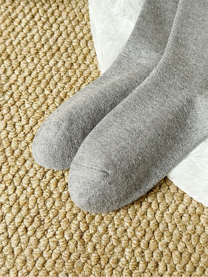 Close-up of the rounded toe seams on gray socks