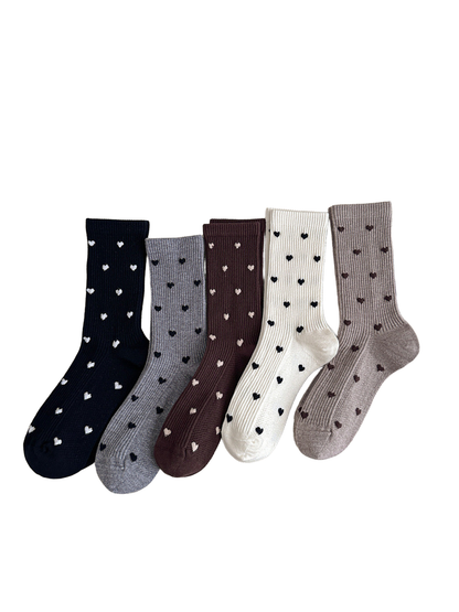Five colors of heart-pattern crew socks arranged together