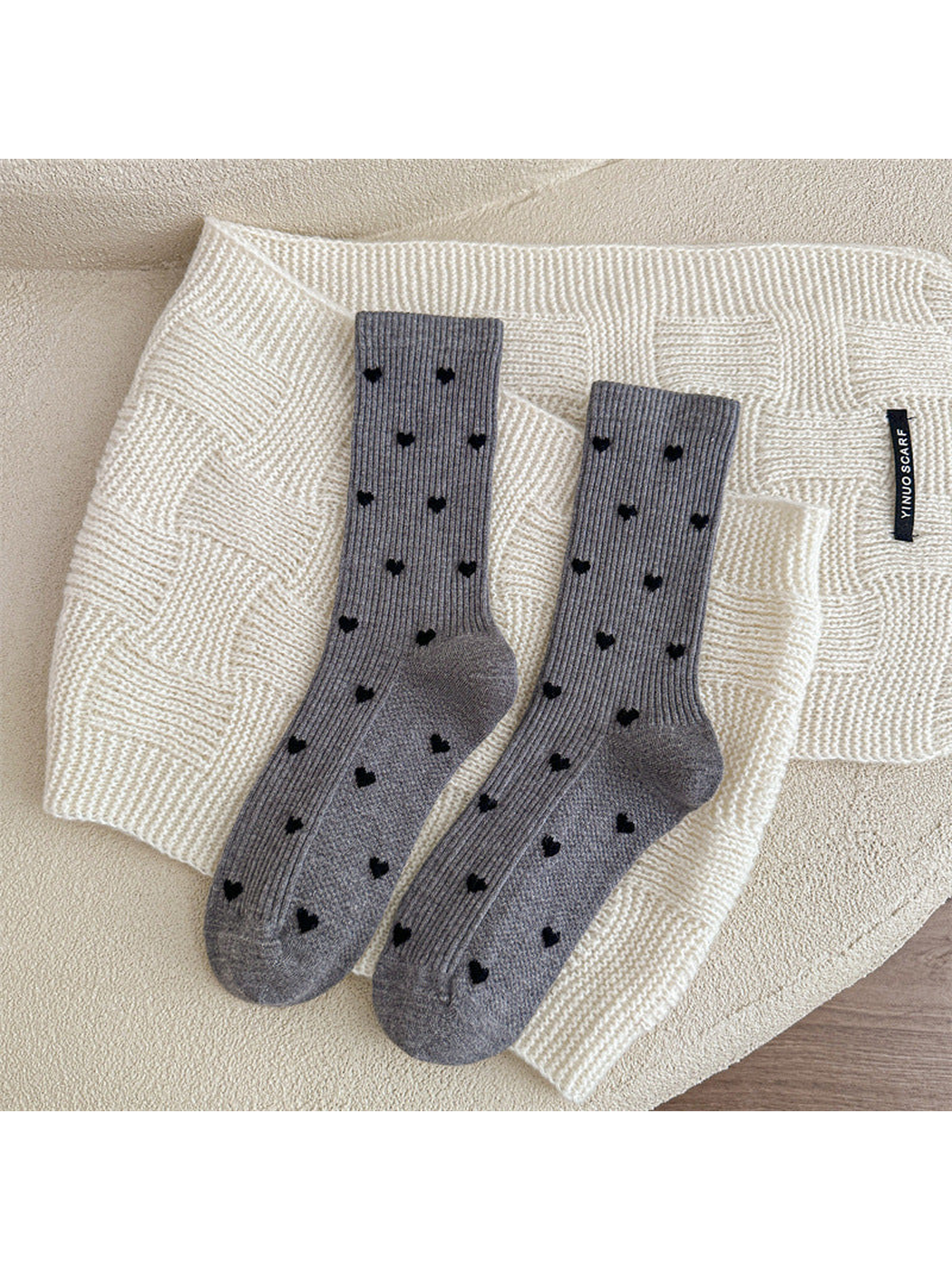 Gray heart-pattern crew socks displayed as a pair
