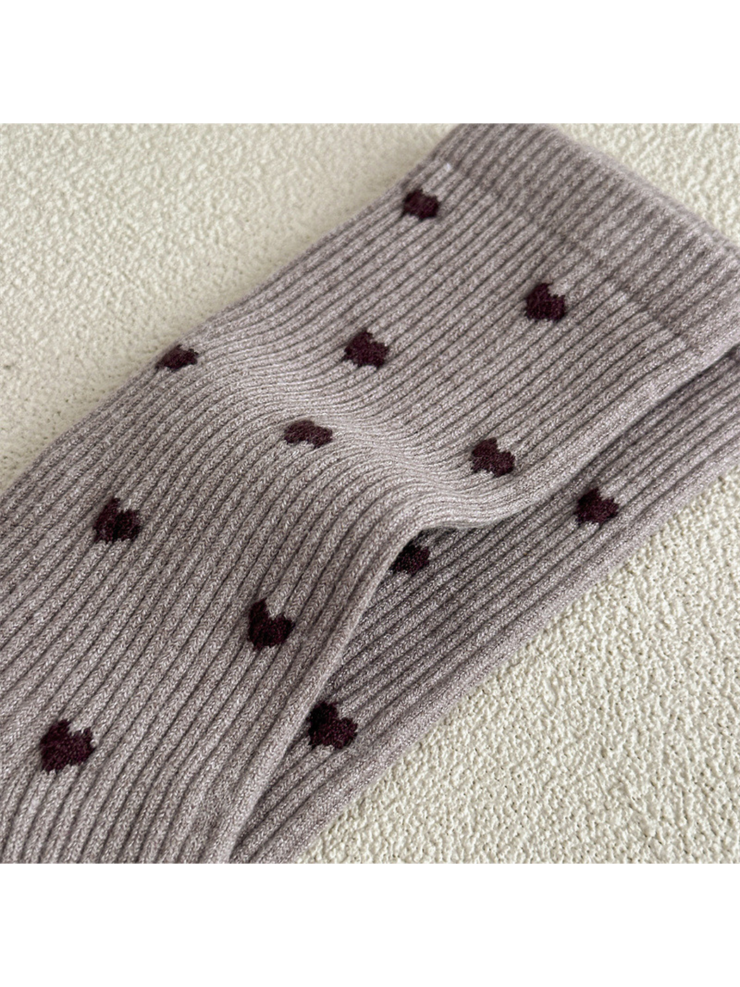 Close-up of vertical ribbing and contrasting heart motifs