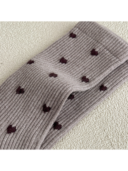 Close-up of vertical ribbing and contrasting heart motifs