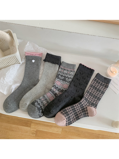 Five gray crew sock styles displayed together