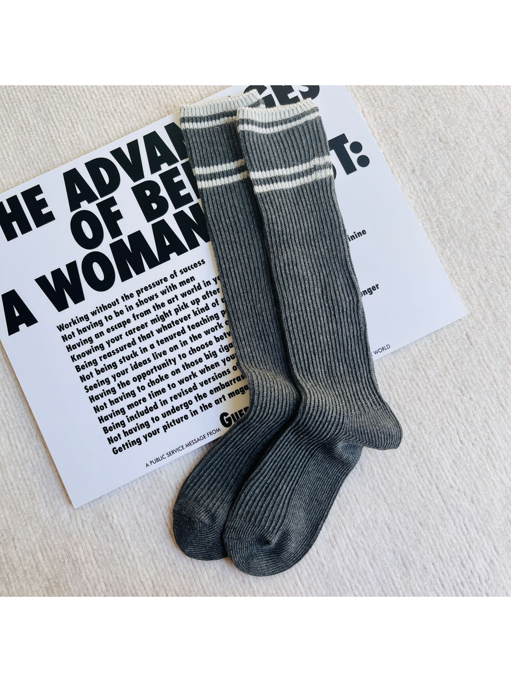 Dark gray ribbed knee-high socks with light gray stripes