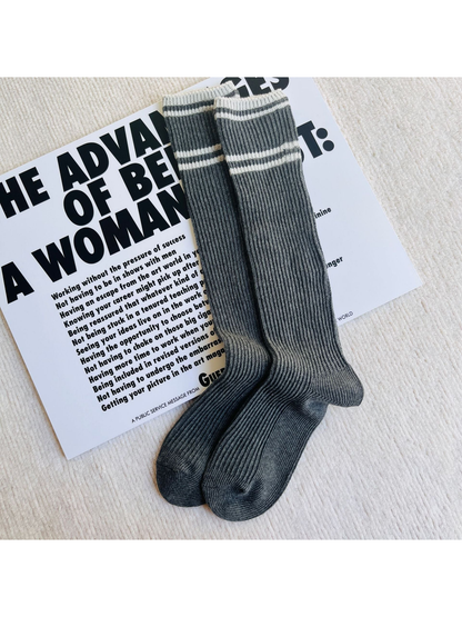 Dark gray ribbed knee-high socks with light gray stripes