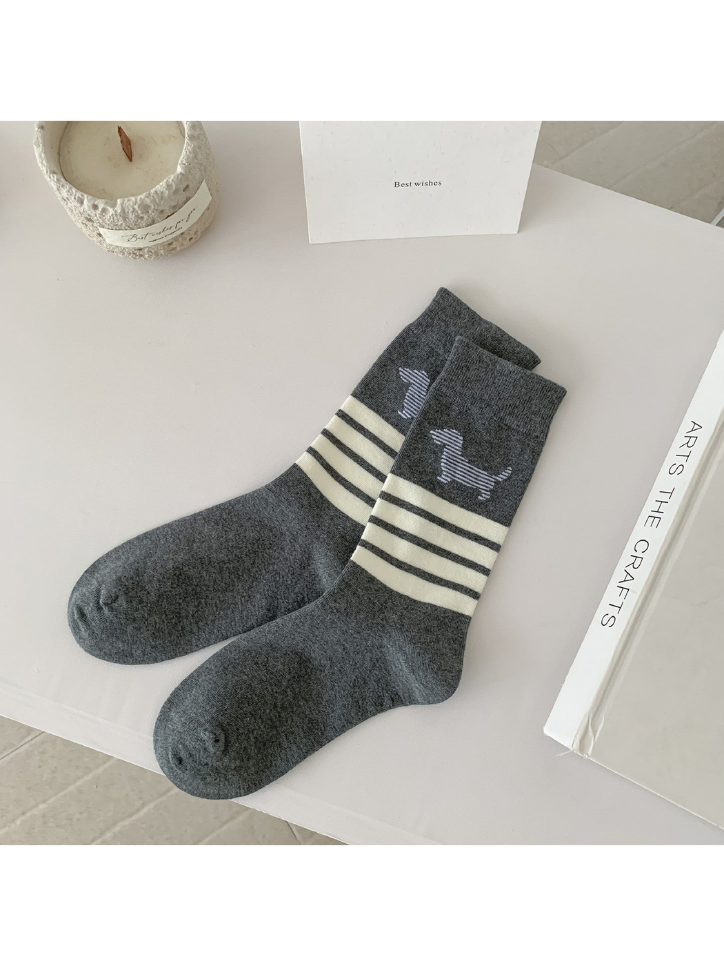 Dark gray crew socks with ivory stripes and a striped dog motif