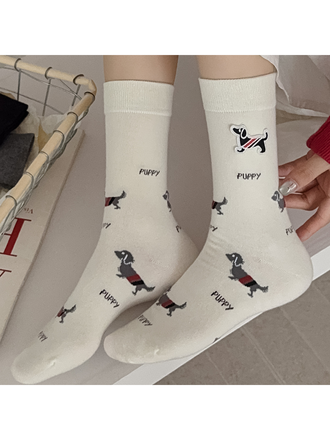 Ivory dog-pattern crew socks worn as a pair