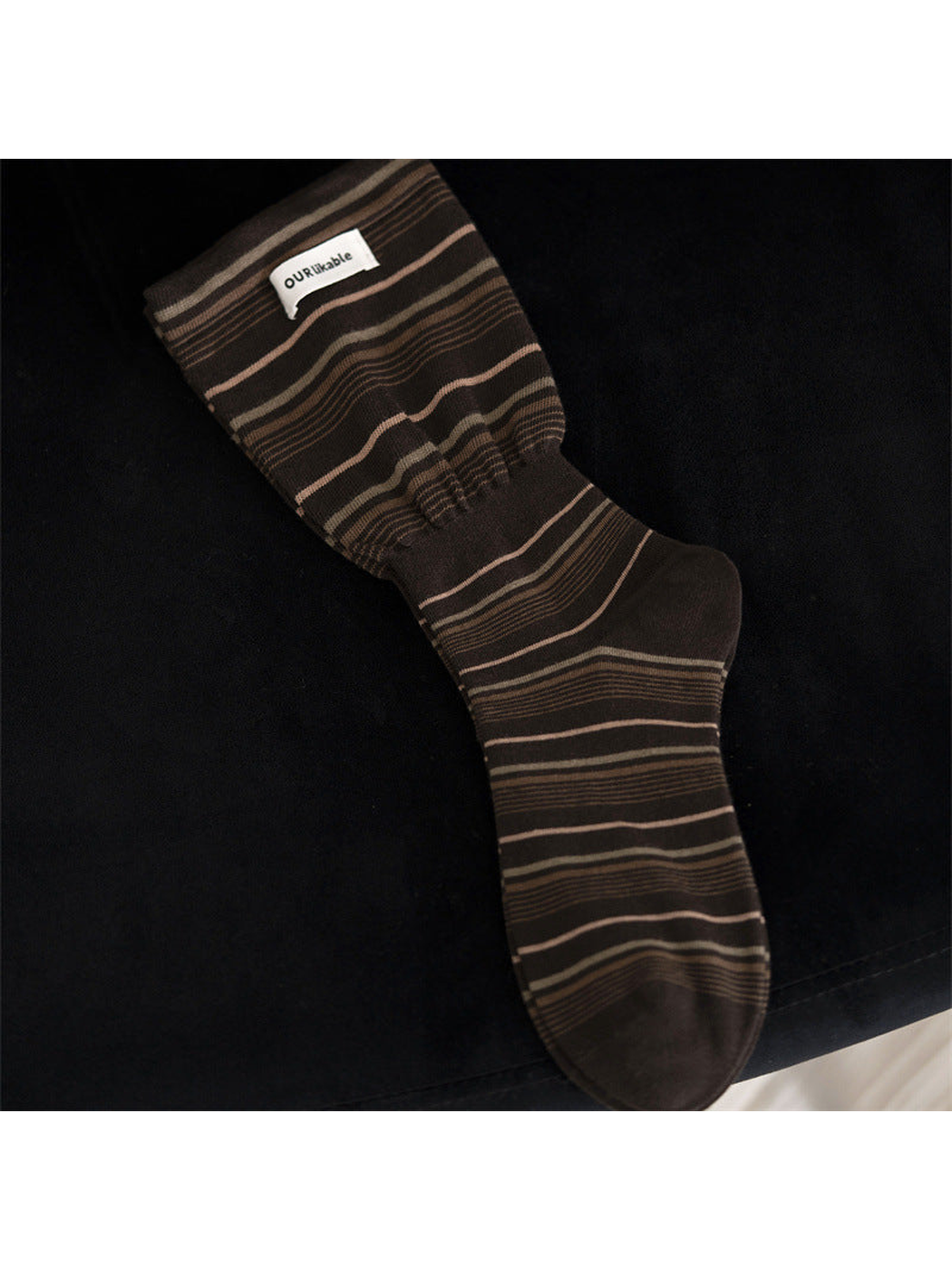Dark coffee striped crew sock with a gathered ankle band