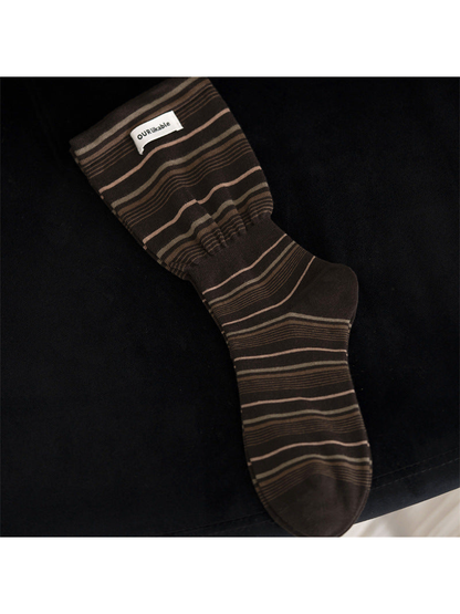 Dark coffee striped crew sock with a gathered ankle band