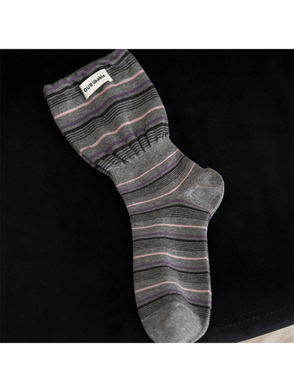 Gray striped crew sock with a gathered ankle band
