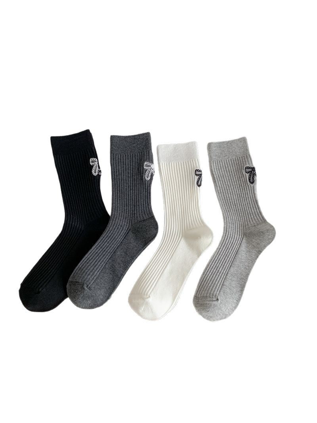 Black, dark gray, ivory and light gray ribbed crew socks displayed together