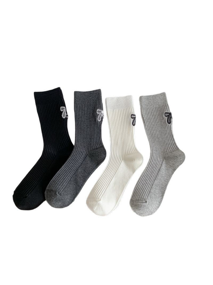 Black, dark gray, ivory and light gray ribbed crew socks displayed together