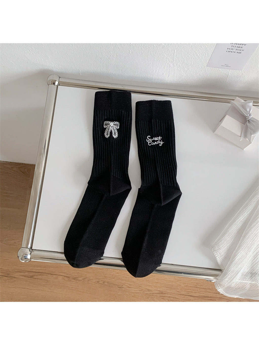 Black ribbed crew socks with bow and script embroidery