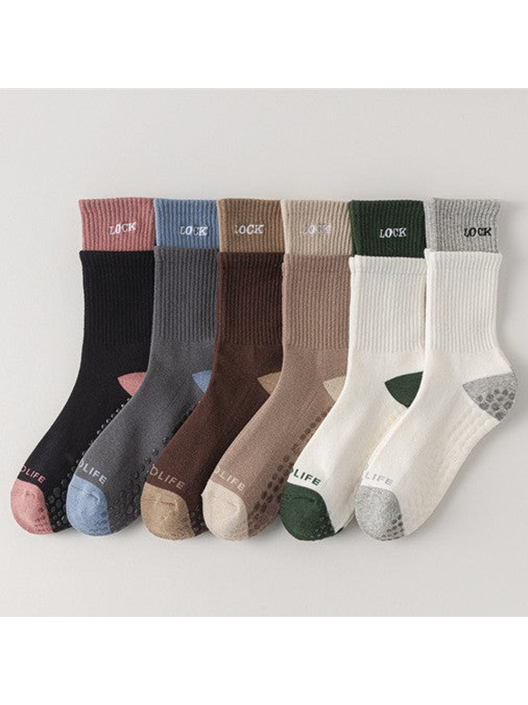 Six color-block crew sock styles arranged side by side