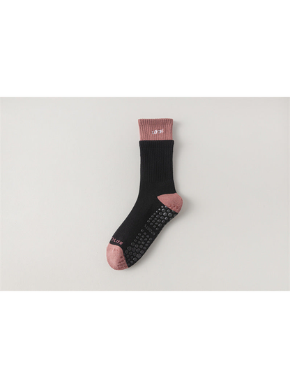 Black crew sock with dusty pink cuff, toe and heel, flat view