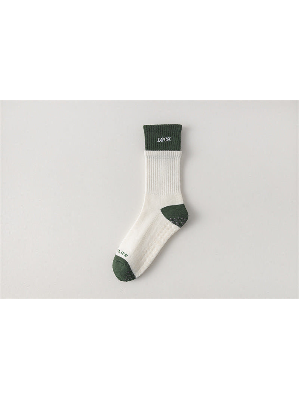 Ivory crew sock with dark green cuff, toe and heel, flat view