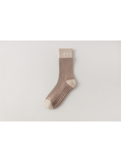 Greige crew sock with cream cuff, toe and heel, flat view