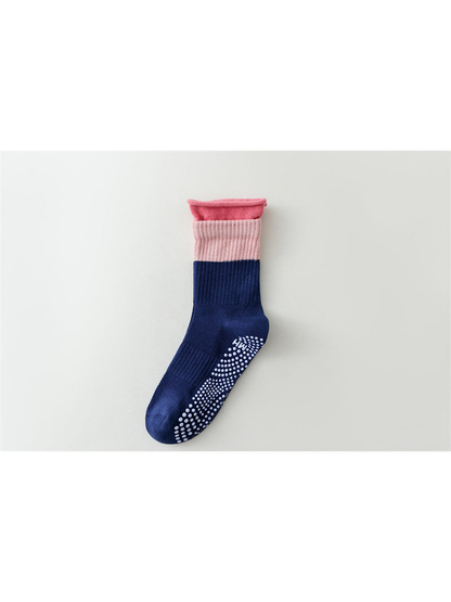 Navy color-blocked crew sock with pale pink band and bright pink rolled edge