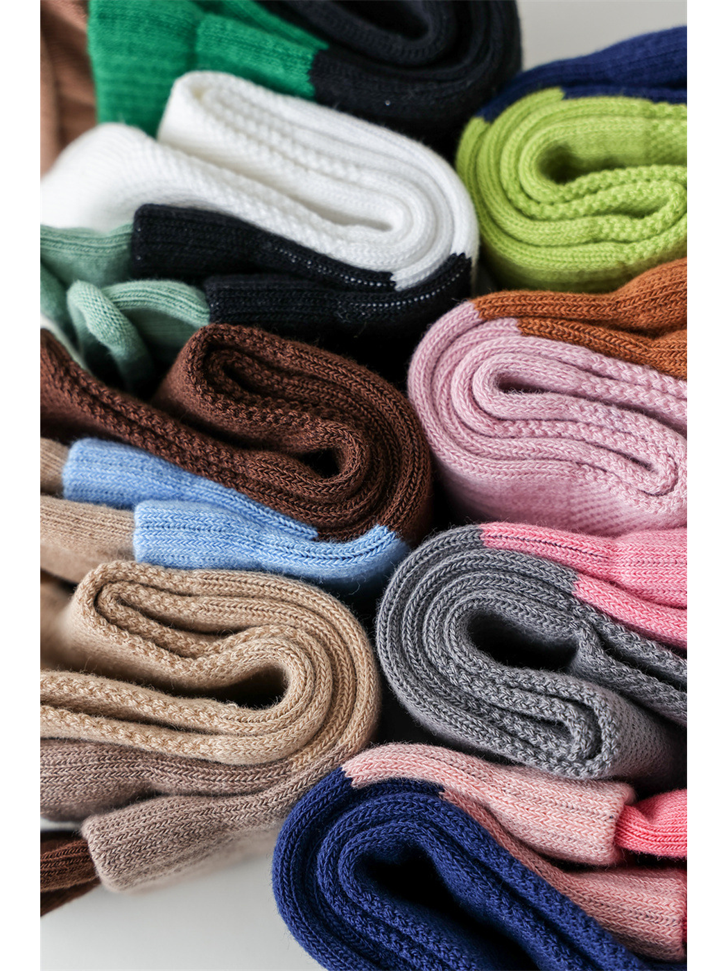 Close-up of folded color-blocked socks and their knit texture