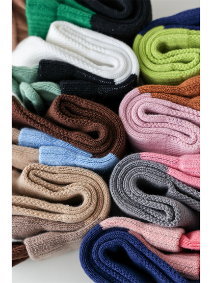 Close-up of folded color-blocked socks and their knit texture