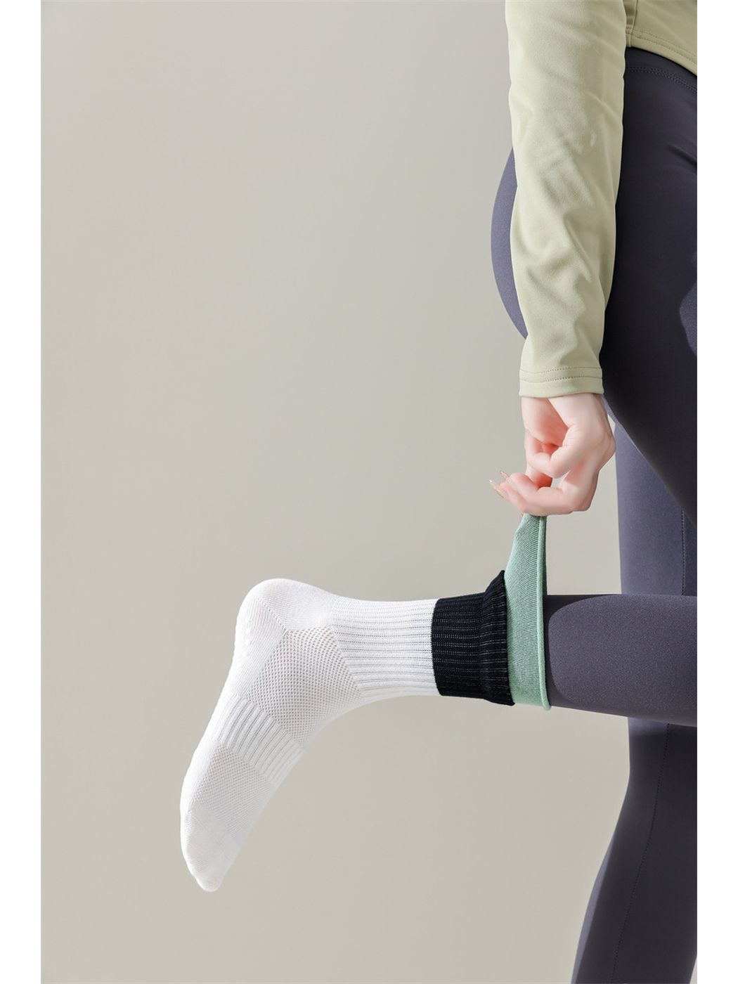 White color-blocked crew sock worn while the mint rolled edge is stretched outward