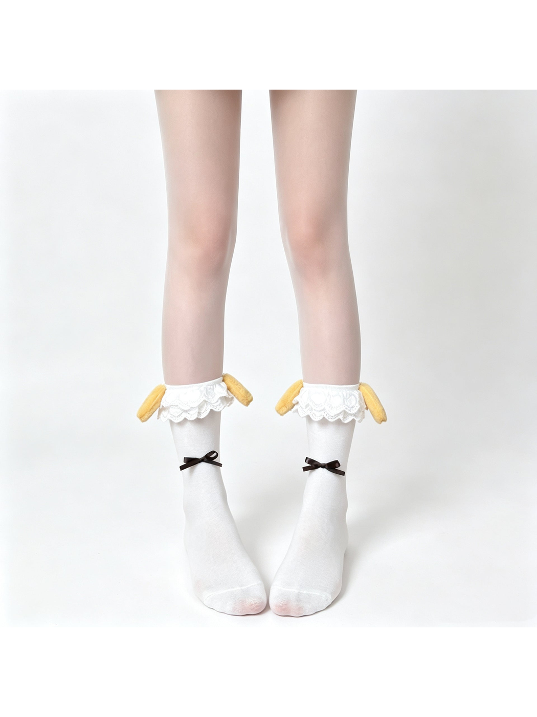 White ankle socks with layered lace cuffs, mustard rabbit-ear accents and brown ribbon bows