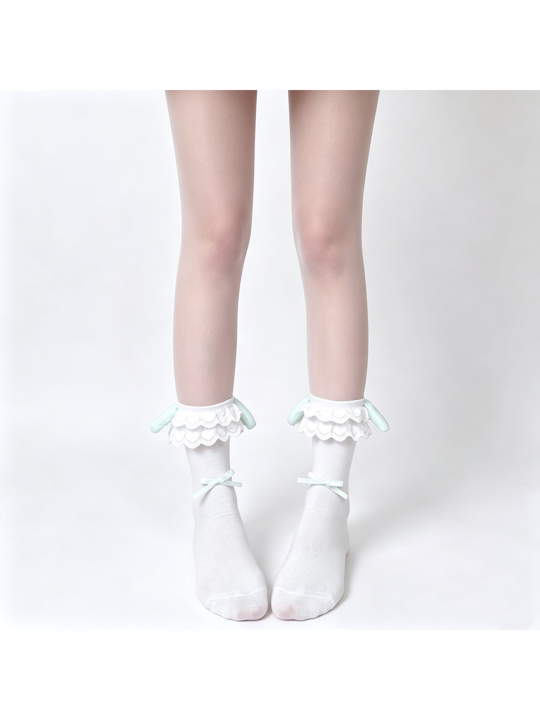 White ankle socks with layered lace cuffs, mint rabbit-ear accents and ribbon bows