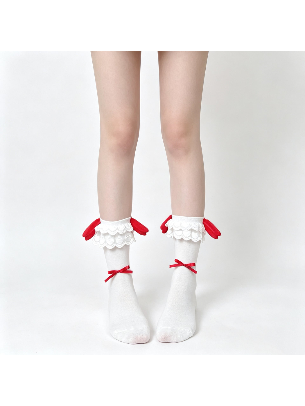 White ankle socks with layered lace cuffs, red rabbit-ear accents and ribbon bows