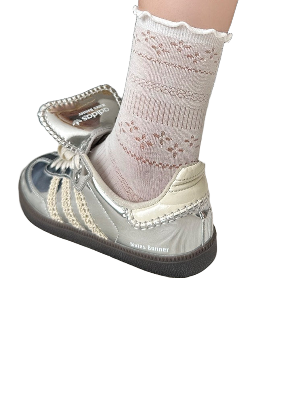 White pointelle crew sock with a ruffled cuff