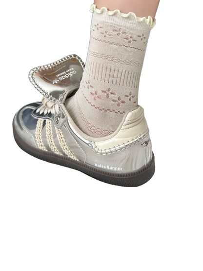 Light green pointelle crew sock with a ruffled cuff