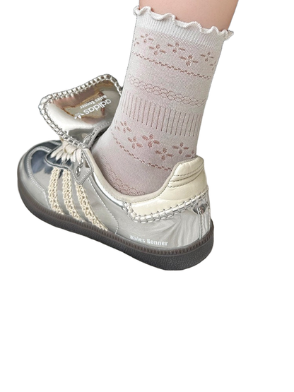 Light gray pointelle crew sock with a ruffled cuff