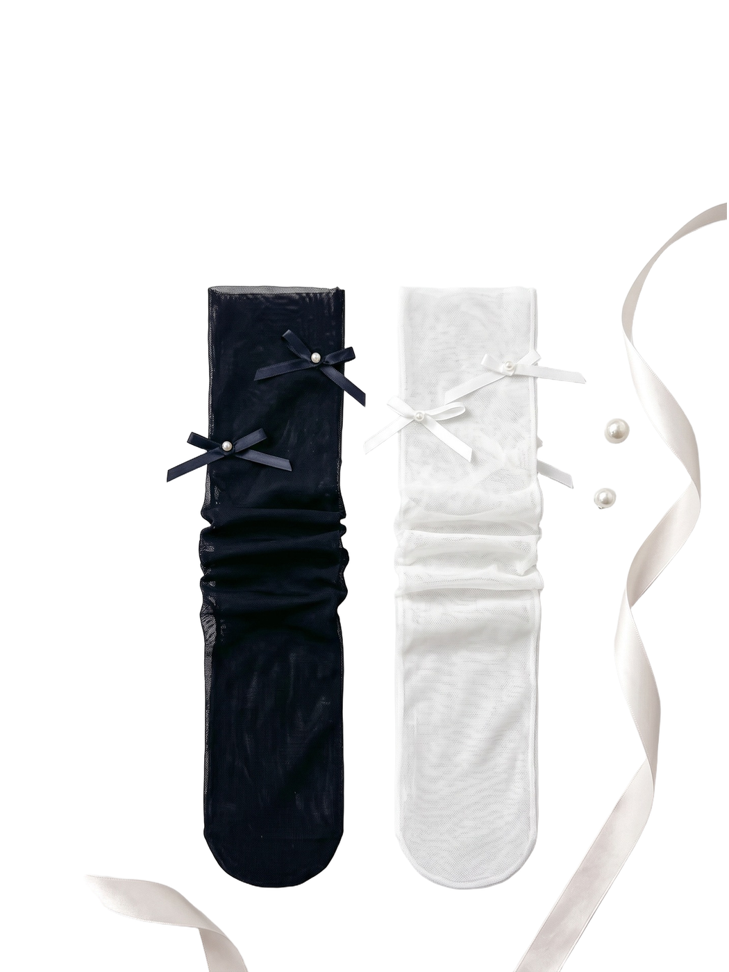 Black and white bow-accent mesh socks arranged side by side