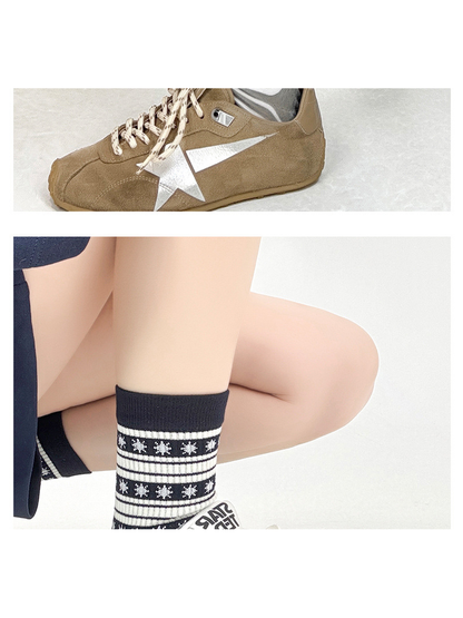 Black patterned crew sock styled with a white sneaker