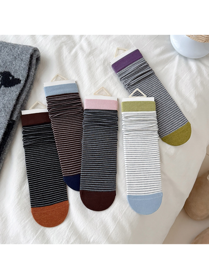 Five striped crew sock color options displayed together