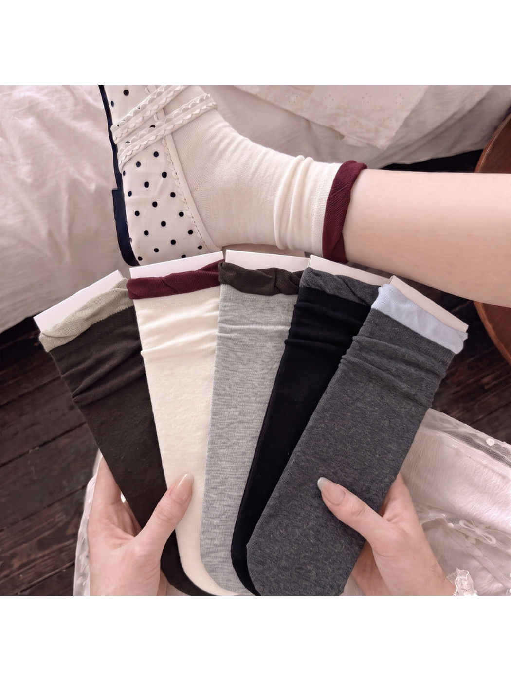 Five contrasting ruffle-cuff sock colors displayed together