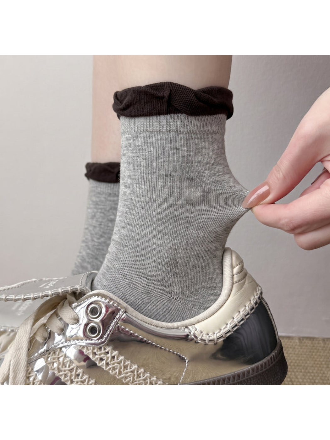 Light gray crew sock with dark brown ruffle cuff