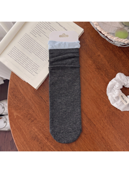 Dark gray crew sock with pale blue ruffle cuff