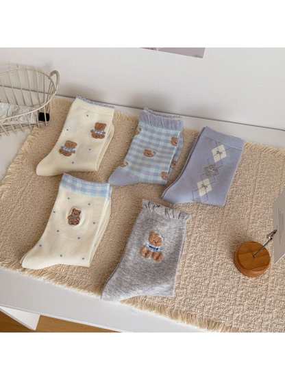 Five bear-pattern crew sock designs displayed together