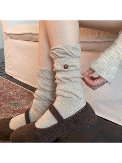 Oatmeal crew socks worn scrunched with brown flats