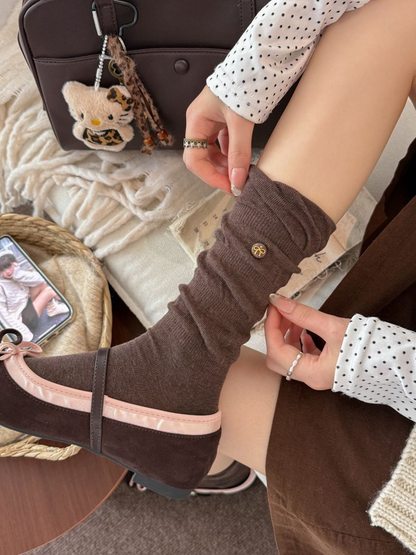 Brown gathered crew sock styled with a brown Mary Jane shoe