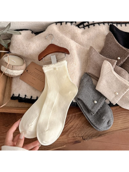 Ivory, gray and neutral ribbed crew socks with pearl-like cuff beads