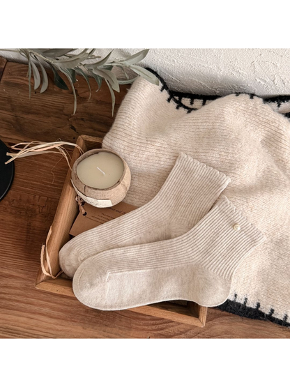 Oatmeal ribbed crew socks with a pearl-like cuff bead