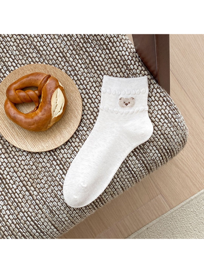 Ivory ankle sock with bear-face applique and raised trim