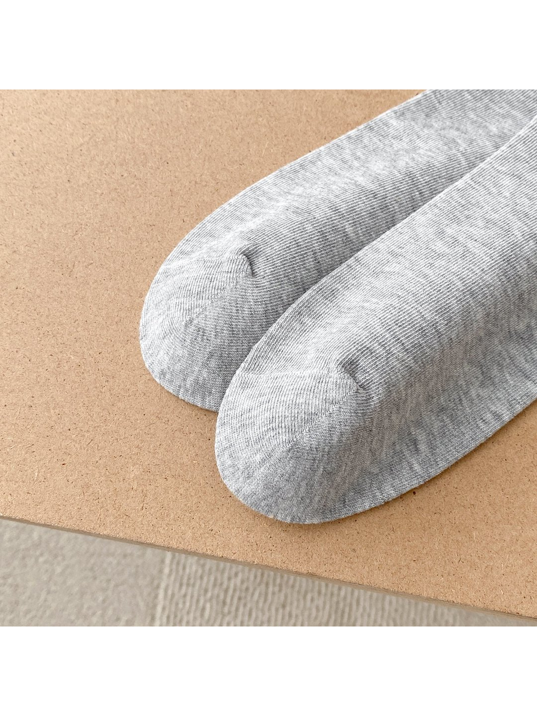 Close-up of gray sock toes and rounded toe seams