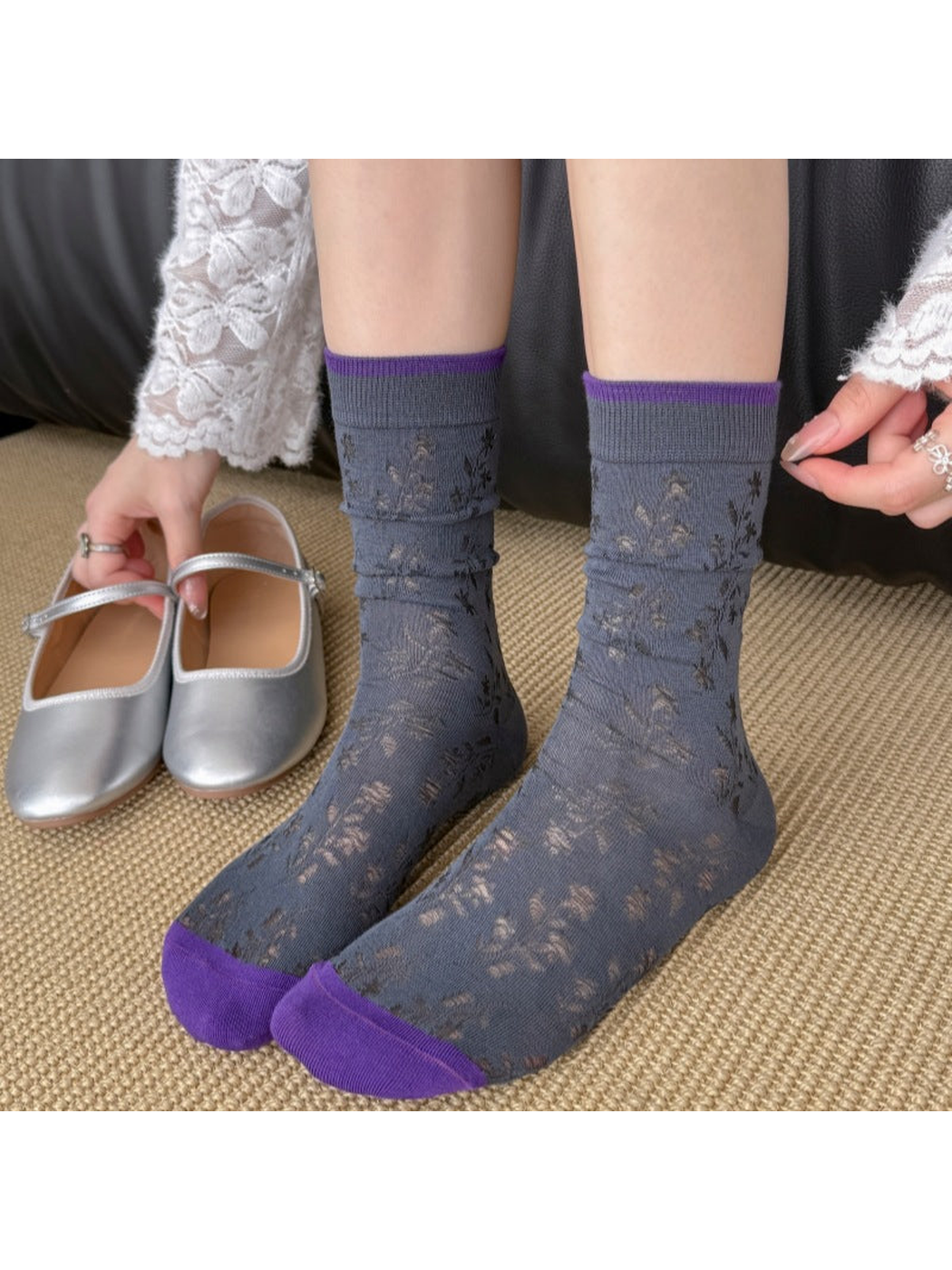 Gray-blue floral openwork crew socks styled with silver flats