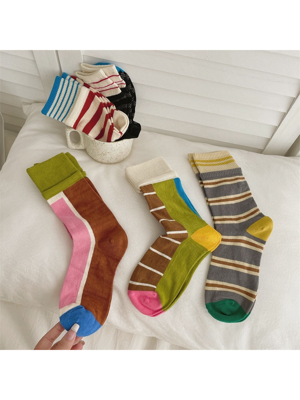 Multiple striped and color-blocked crew sock styles displayed together
