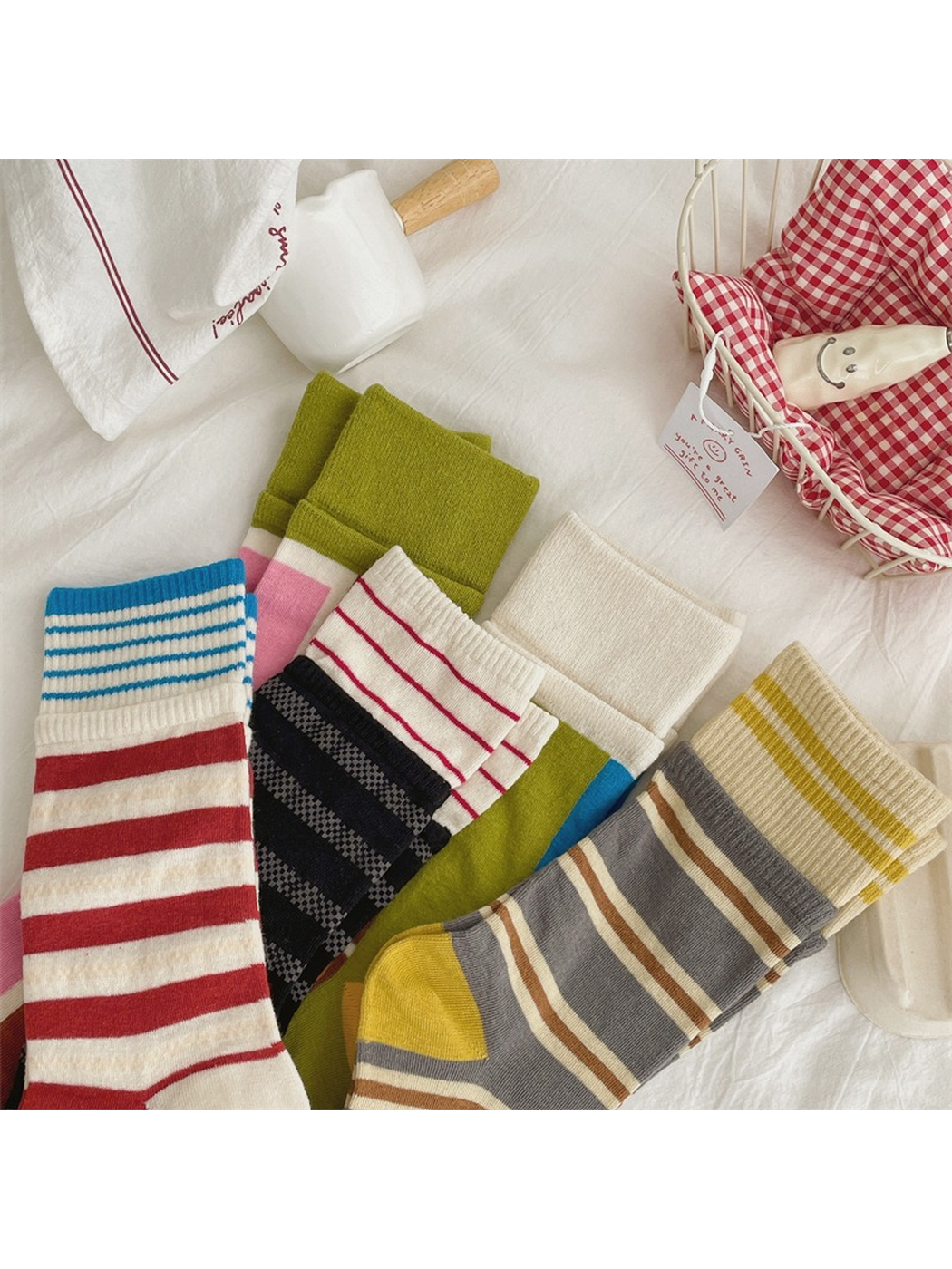Close-up of contrasting ribbed cuffs, stripes and color-blocked sock patterns
