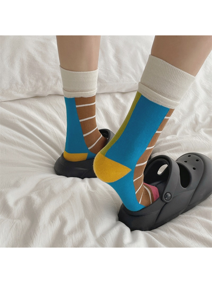 Brown and green color-blocked crew socks worn with black clogs