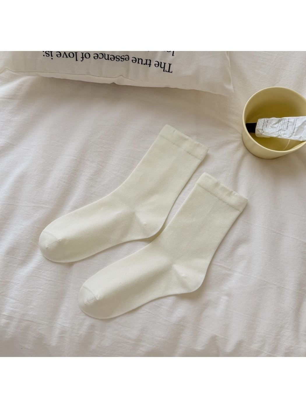 Plain ivory crew socks with narrow cuffs