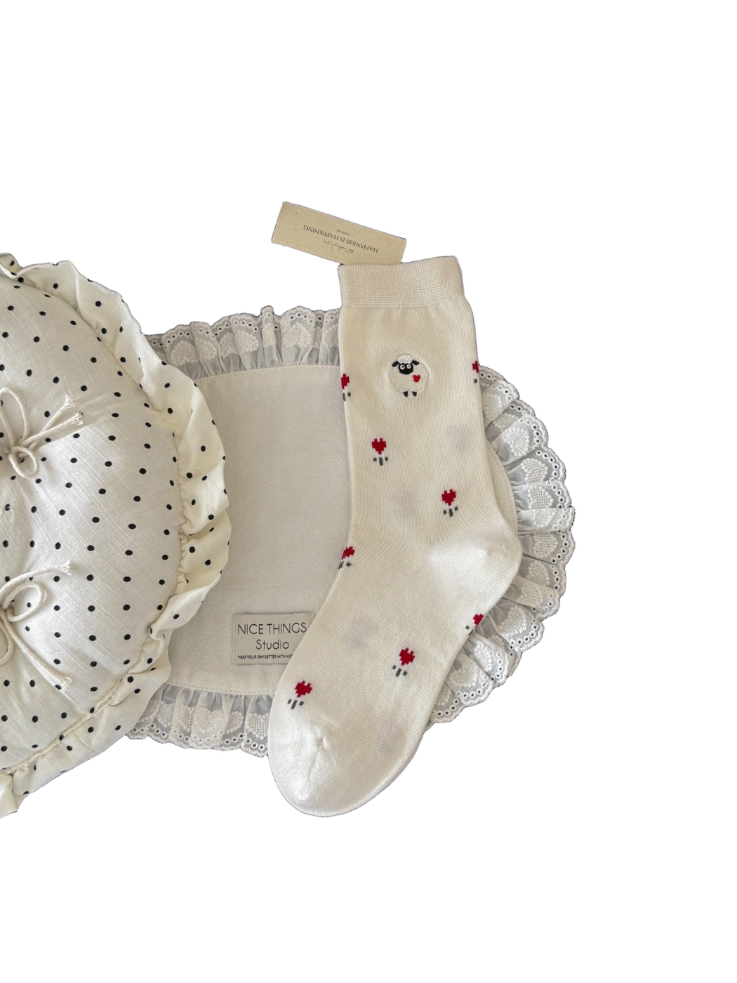 Ivory crew sock with raised sheep patch and scattered red flowers, full view