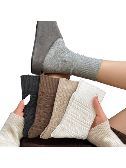 Textured crew socks in five neutral colors displayed together